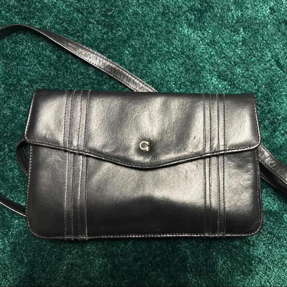 Sleek Black Wallet with Flap Closure and Segmented Design